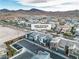 Aerial view of the property showcases a community of modern townhomes with mountain views at 2699 Chance Canyon St, Henderson, NV 89044
