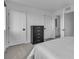Cozy bedroom showcases a sleek black dresser and doors for added charm at 2699 Chance Canyon St, Henderson, NV 89044
