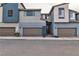 Contemporary townhouse showcasing a modern front facade and two-car garage at 2699 Chance Canyon St, Henderson, NV 89044