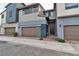 Attractive townhouse showcasing modern design with a two-car garage and stylish entrance at 2699 Chance Canyon St, Henderson, NV 89044