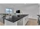 Open-concept kitchen with a breakfast bar, stainless steel appliances, and seamless integration with the living area at 2699 Chance Canyon St, Henderson, NV 89044