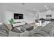Comfortable living area with modern furnishings, open layout to kitchen, and bright ambiance at 2699 Chance Canyon St, Henderson, NV 89044