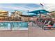 Community pool with lounge chairs and shaded areas; ideal for relaxation and social gatherings at 2699 Chance Canyon St, Henderson, NV 89044