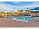 Community swimming pool with lounge chairs and umbrellas, perfect for relaxation and recreation at 2699 Chance Canyon St, Henderson, NV 89044
