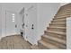Staircase to second floor, wood flooring, and front door at 2699 Chance Canyon St, Henderson, NV 89044