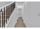 Carpeted staircase with modern black metal railing and tile floors at 2699 Chance Canyon St, Henderson, NV 89044