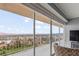 Spacious balcony with stunning views of the city skyline and distant mountains through large sliding glass doors at 3111 Bel Air Dr # 20D, Las Vegas, NV 89109