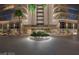 Regency Towers entrance featuring beautiful landscaping and a well-maintained circular driveway at 3111 Bel Air Dr # 20D, Las Vegas, NV 89109