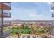 Expansive city views from the balcony showcasing golf course, city scape, and the nearby mountains at 3111 Bel Air Dr # 20D, Las Vegas, NV 89109