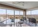 Elegant dining area with floor to ceiling windows offering stunning city and mountain views at 3111 Bel Air Dr # 20D, Las Vegas, NV 89109