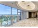 Hallway with city views, marble floors, balcony, and modern lighting at 3111 Bel Air Dr # 20D, Las Vegas, NV 89109