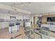 Modern kitchen with granite countertops, white cabinets and stainless steel appliances with breakfast bar at 3111 Bel Air Dr # 20D, Las Vegas, NV 89109