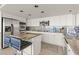 Stylish kitchen featuring stainless steel appliances, granite countertops, a breakfast bar, and ample cabinet space at 3111 Bel Air Dr # 20D, Las Vegas, NV 89109
