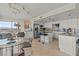 Bright and airy kitchen with stainless steel appliances, white cabinetry, and city views at 3111 Bel Air Dr # 20D, Las Vegas, NV 89109