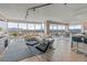 Spacious open-concept living room with floor-to-ceiling windows offering panoramic city and mountain views at 3111 Bel Air Dr # 20D, Las Vegas, NV 89109