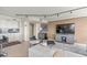 Modern living room adjacent to the kitchen, with a large TV and comfortable seating area at 3111 Bel Air Dr # 20D, Las Vegas, NV 89109