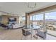 Comfortable living and dining area with floor-to-ceiling windows providing a panoramic view of the city at 3111 Bel Air Dr # 20D, Las Vegas, NV 89109