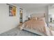 Comfortable bedroom featuring a tufted headboard, patterned rug, and artwork, creating a relaxing atmosphere at 3111 Bel Air Dr # 20D, Las Vegas, NV 89109