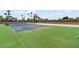 Well-maintained community tennis court surrounded by lush landscaping and clear skies at 3111 Bel Air Dr # 20D, Las Vegas, NV 89109