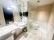 Modern bathroom with floating vanity, marble accents, and a large mirror, creating a spa-like atmosphere at 4381 W Flamingo Rd # 2109, Las Vegas, NV 89103
