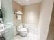 Clean, modern bathroom featuring a toilet, marble tile accents, and fresh towel rack at 4381 W Flamingo Rd # 2109, Las Vegas, NV 89103