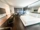 Modern bedroom suite boasts a king bed, seating area and city views at 4381 W Flamingo Rd # 2109, Las Vegas, NV 89103