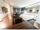 Modern bedroom suite boasts a king bed, seating area and desk space at 4381 W Flamingo Rd # 2109, Las Vegas, NV 89103