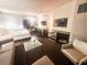 Open floor plan featuring a seating area, and modern kitchenette with TV at 4381 W Flamingo Rd # 2109, Las Vegas, NV 89103