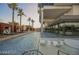 Inviting pool area with modern lounge furniture and palm trees, creating a resort-style atmosphere at 4381 W Flamingo Rd # 2109, Las Vegas, NV 89103