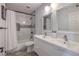 Beautiful bathroom featuring dual sinks, tile floors, a tub and shower at 500 Duchess Ave, North Las Vegas, NV 89030