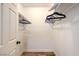 Walk-in closet with a wood-look floor and closet rods at 500 Duchess Ave, North Las Vegas, NV 89030
