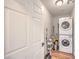 Convenient laundry room with a stackable washer/dryer unit and room for storage at 500 Duchess Ave, North Las Vegas, NV 89030