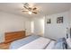 Spacious main bedroom featuring wood-look floors, light, and a dresser at 500 Duchess Ave, North Las Vegas, NV 89030