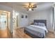 Cozy main bedroom with wood-look floors, a soft bed, and serene decor at 500 Duchess Ave, North Las Vegas, NV 89030