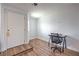 Bright interior featuring wood-look flooring, white walls, and a compact desk setup at 500 Duchess Ave, North Las Vegas, NV 89030
