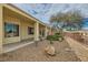 Lush backyard with desert landscaping and a covered patio at 538 Cypress Gardens Pl, Henderson, NV 89012