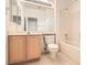 Bathroom featuring a single vanity, mirror, and a shower-tub combination at 538 Cypress Gardens Pl, Henderson, NV 89012
