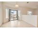 Bright dining room boasts tile flooring and access to the backyard through a sliding glass door at 538 Cypress Gardens Pl, Henderson, NV 89012