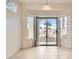Bright dining room boasts tile flooring and access to the backyard through a sliding glass door at 538 Cypress Gardens Pl, Henderson, NV 89012