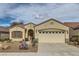 Inviting single-story home featuring a large two-car garage, desert landscaping, and a cozy front entrance at 538 Cypress Gardens Pl, Henderson, NV 89012