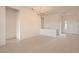 Bright living room with neutral walls, tile flooring, and views into other rooms through open doorways at 538 Cypress Gardens Pl, Henderson, NV 89012