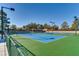 Well-maintained community tennis courts on a sunny day at 538 Cypress Gardens Pl, Henderson, NV 89012