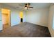 A spacious bedroom with neutral carpet and an ensuite bathroom and walk-in closet at 538 Ylang Pl, Henderson, NV 89015