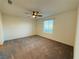 Spacious bedroom with neutral carpet, fan, and natural light from the window at 538 Ylang Pl, Henderson, NV 89015