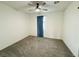 Bedroom featuring neutral walls, plush carpet, and a ceiling fan at 538 Ylang Pl, Henderson, NV 89015
