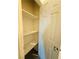 Walk-in closet featuring white shelving and a door at 538 Ylang Pl, Henderson, NV 89015