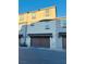 Well-maintained two-story townhome featuring a garage and neutral-colored exterior at 538 Ylang Pl, Henderson, NV 89015
