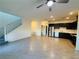 Open-concept living area featuring tile flooring that transitions into a modern kitchen at 538 Ylang Pl, Henderson, NV 89015