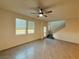 Open living room featuring tile floors, abundant natural light, and access to the staircase at 538 Ylang Pl, Henderson, NV 89015