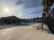Inviting community pool with sun loungers and palm trees, creating a resort-like atmosphere for residents at 538 Ylang Pl, Henderson, NV 89015